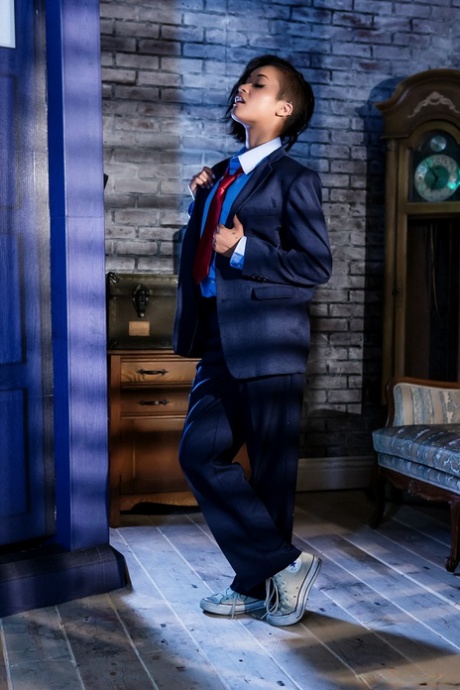 Black dime Skin Diamond strips out of menswear to model in the nude