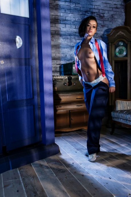 Black dime Skin Diamond strips out of menswear to model in the nude