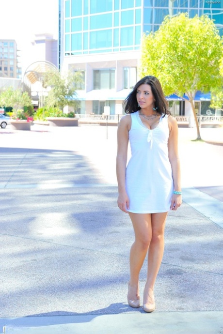 Black haired babe Madeline doffs her white dress to expose her arousing body