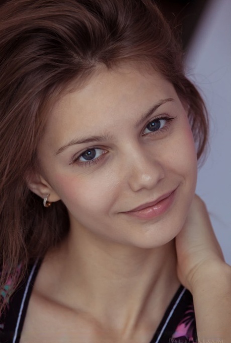 Ukrainian solo girl Emma Sweet creams herself while disrobing for nude poses