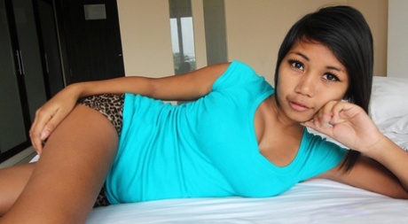 Beautiful Asian with huge dark nipples rubbing her smooth shaved pussy