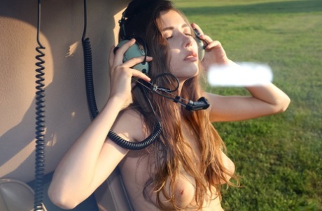 Stunning teenage model Milla posing topless in fishnet pantyhose