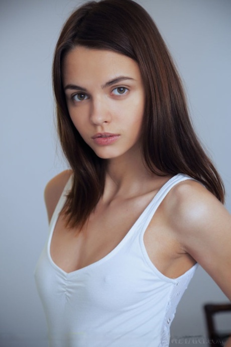 Erotic teen Lilit A undressing to bare tiny tits & small ass close up