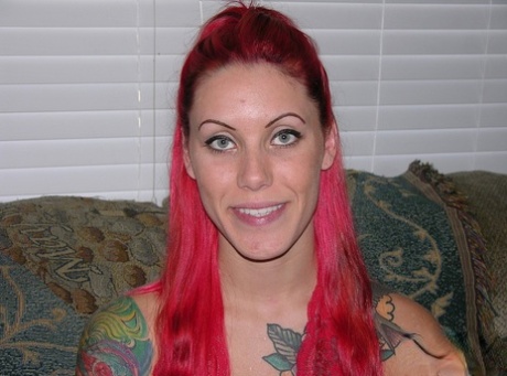 Tattooed redhead Jae puts the focus on her pierced pussy during her nude debut