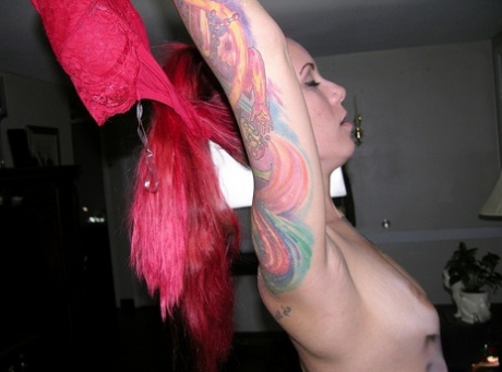 Tattooed redhead Jae puts the focus on her pierced pussy during her nude debut