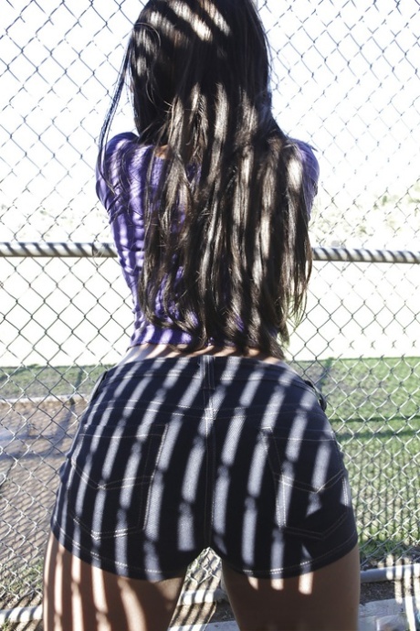 Busty ebony babe in tight shorts flashing outdoor and stripping