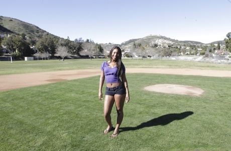 Busty ebony babe in tight shorts flashing outdoor and stripping