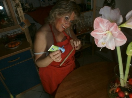 Horny oma Caro pleasures her pussy with a wooden spoon and a cucumber