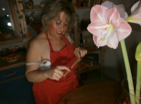 Horny oma Caro pleasures her pussy with a wooden spoon and a cucumber