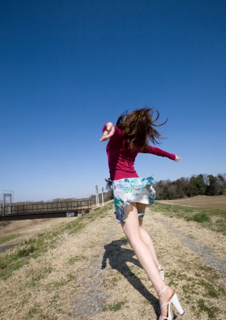 Beautiful Japanese girl Maiko Kazano uncovers her great tits as she gets naked