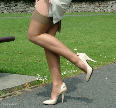 Outdoor posing from a beautiful non nude model in high heels Donna
