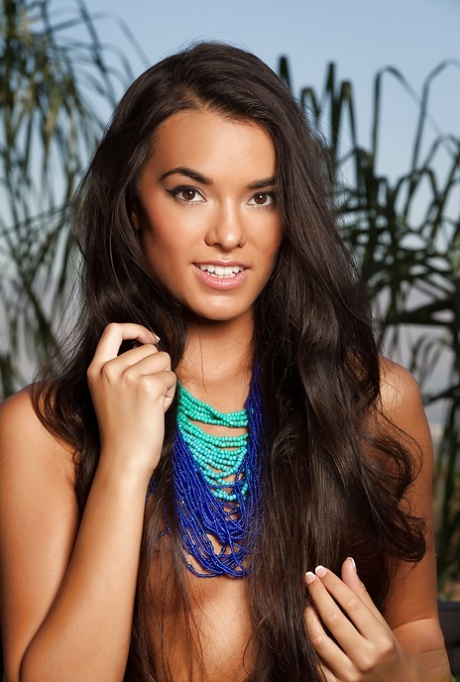 Svelte brunette babe Joanie Brosas posing topless and taking off her panties