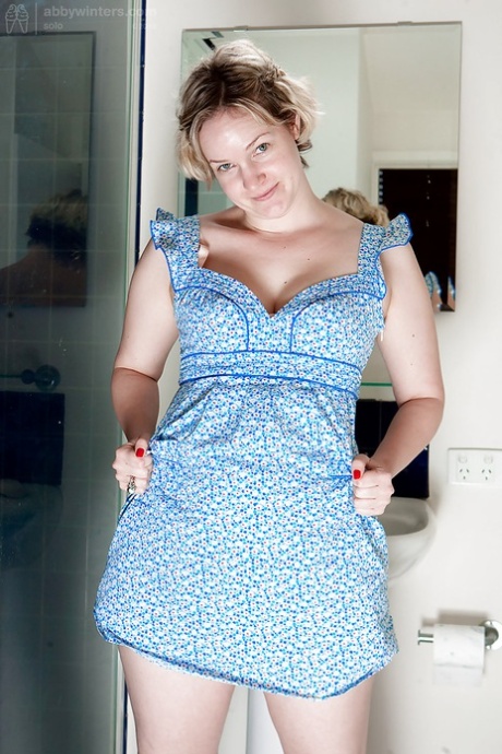 Blonde BBW Zita undresses in bathroom and takes hairy cunt to the shower