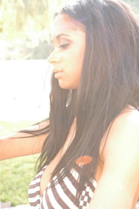 Black dime Tyra Moore uncups her huge boobs outdoors in her modeling debut