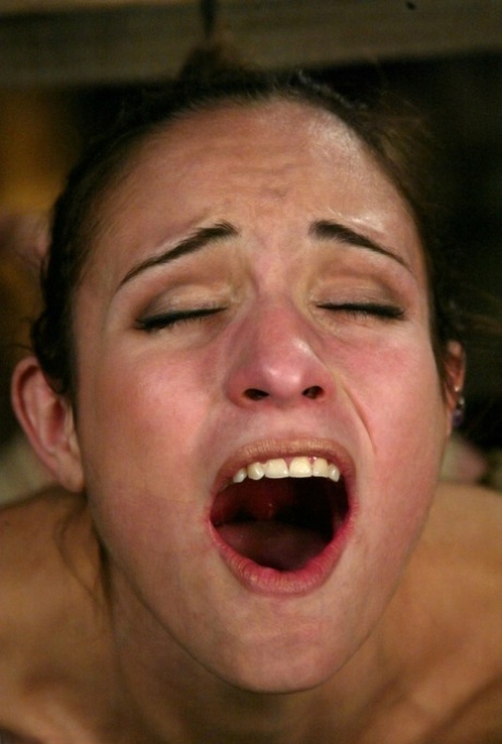 Tied-up MILF Amber Rayne has tit suckers and clamps attached to her nips