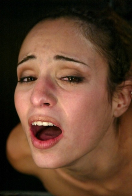 Tied-up MILF Amber Rayne has tit suckers and clamps attached to her nips