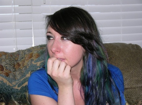 Brunette amateur shows off her bare ass prior to fingering her pussy