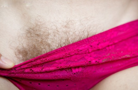 Amateur glasses laden chick Nora spreads her hairy vagina outdoors