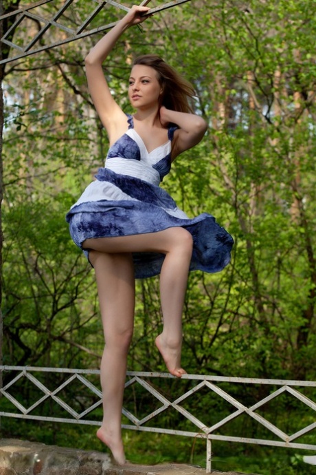 Smiley faced teen Nikia A removing dress for outdoor glamour spread